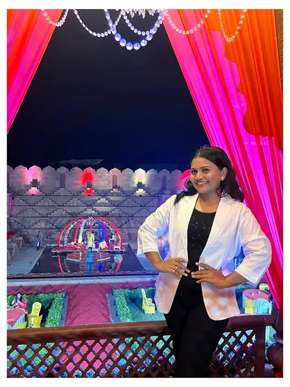 A smile of satisfaction after a successful event setup. My goal is to win once in such a way that people remember it forever, and that's the dedication I bring to your wedding.