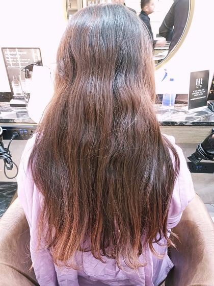 The "before" shot for a Hair Botox treatment, showing wavy and slightly frizzy hair.