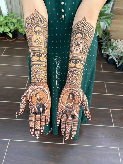Another view of the engagement mehendi with couple portraits, set against a lovely green background.