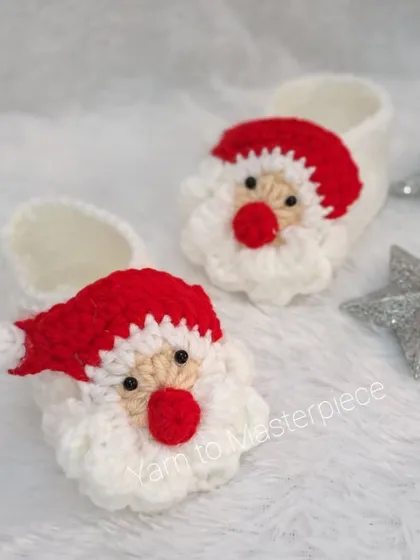 Get into the festive spirit with these adorable Santa Claus booties. They feature Santa's face, complete with a fluffy beard and red hat.
