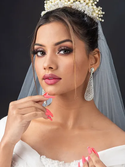 Creating the perfect Christian bridal look is about soft elegance. Here, my student has beautifully executed a minimal yet glowing makeup look, paired with a classic updo and veil.