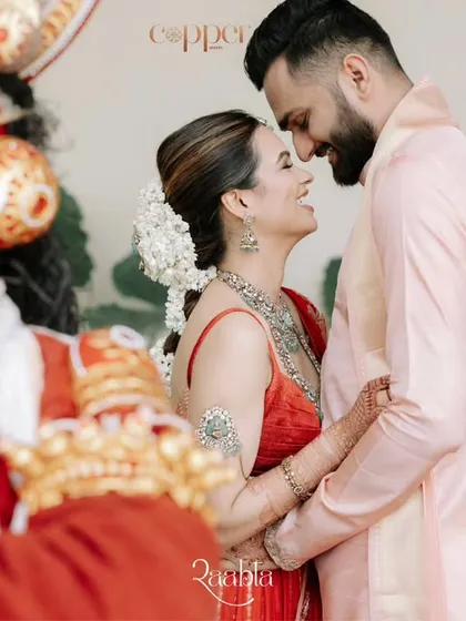 Capturing the glow of love in 'God's Own Country'. This couple's portrait, framed by Kathakali dancers in Kochi, showcases how we integrate local culture into a destination wedding for a truly authentic experience.