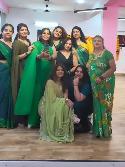 A mirror selfie with my girls during our Teej celebration. The large mirror is perfect for group photos.