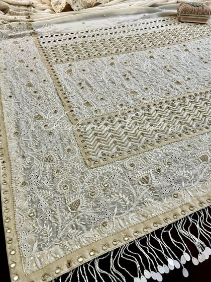 A view of the saree's pallu, showcasing the stunning tassel border.