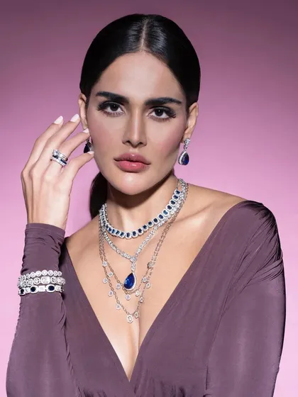 A confident and direct portrait from the sapphire collection shoot. The styling here is clean and powerful, letting the intricate, layered necklaces command full attention.