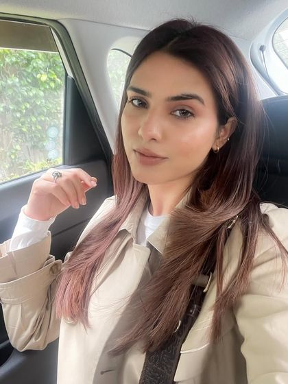 A car selfie showing off my new hair color post-Garnier collaboration. The natural light from the window highlights the tones and shine of the hair, providing an authentic "after" shot.