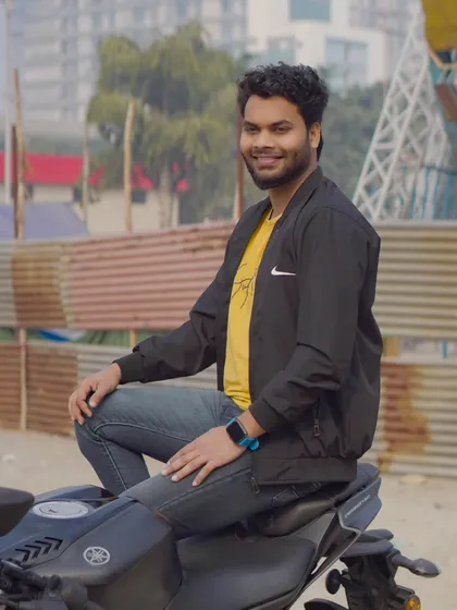 A side-profile shot of the model sitting on the bike. This provides a different angle and a more candid feel.