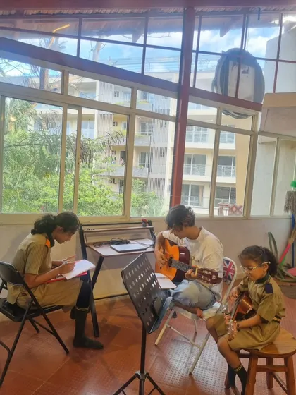A glimpse into a typical day at our Rustam Bagh studio. Here, students are learning guitar chords and writing down music theory notes. We make sure learning is interactive, hands-on, and fun.