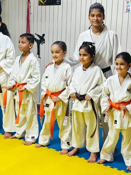 A group of our young students posing with their new belts. Belt promotions are an important milestone, marking their progress and achievements in karate.