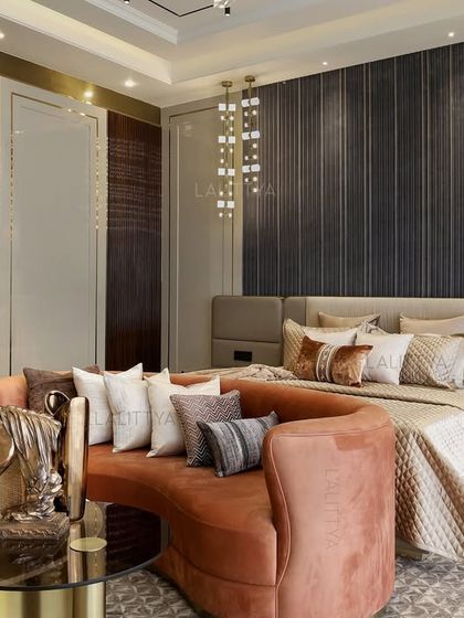 This master bedroom feels lived-in yet elevated. We created a fluted graphite-toned backdrop and paired it with a custom blush-pink curved sofa that wraps around the bed, making the space restful without being minimal, and indulgent without being loud.