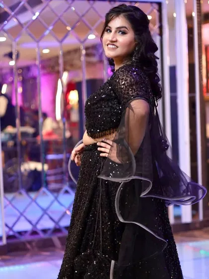 A twirl to show off the beautiful ruffled dupatta. The makeup is flawless and ready for the dance floor.