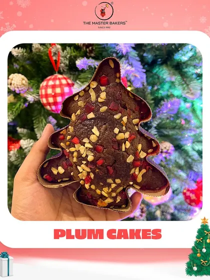 The holiday season isn't complete without the taste of a classic plum cake. Our Christmas tree-shaped plum cake, rich with fruits and nuts, is a festive favorite that brings the magic of the season to your dessert table.