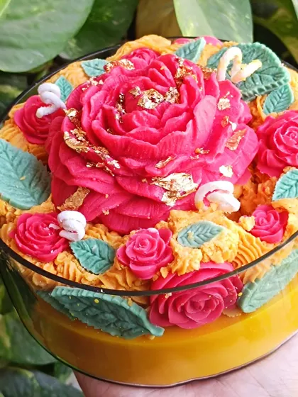 Another close-up of the intricate floral details on the rose garden candle.