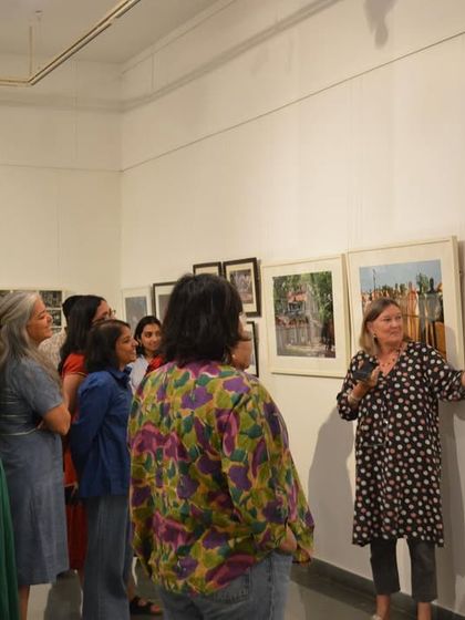 Artist Clare Arni giving a walkthrough of her exhibition 'Southern Stars' to a team from MAP Bangalore. These guided tours provide invaluable insight into the artist's collection and vision.