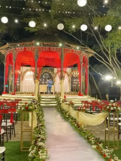 A closer look at the red gazebo mandap, ready for the evening's celebrations.