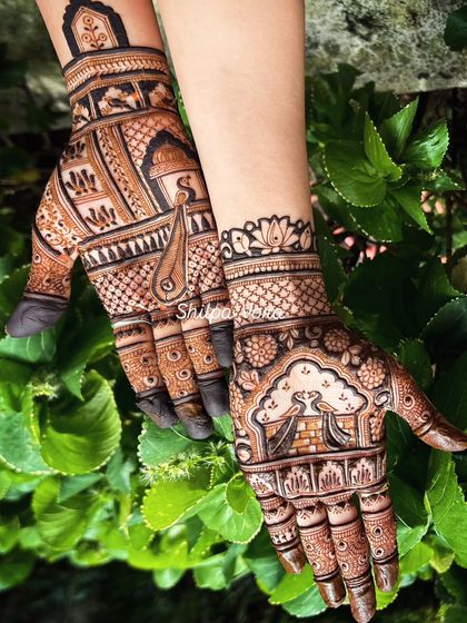 A rich, full-hand design featuring a 'doli' (palanquin) and peacock motifs, ideal for a bride.