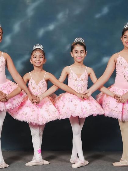 Our youngest ballerinas dressed for their 'Barbie x Swan Lake' performance. With their tiaras and pink tutus, they are ready to bring a touch of fairytale magic to the stage.