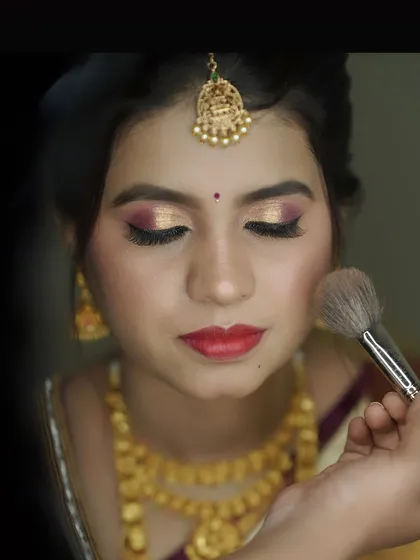 A behind the scenes shot of me applying blush to complete the look.
