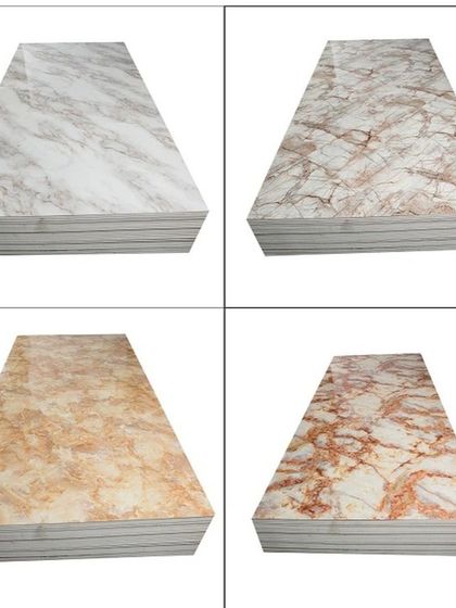A collection of four different PVC marble sheet designs, showcasing the variety of colors and vein patterns available, from beige to reddish tones.