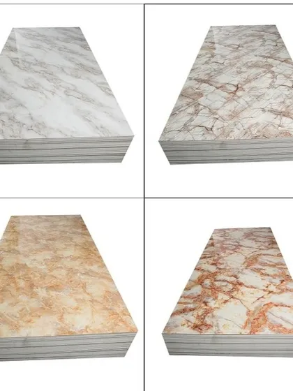 A collection of four different PVC marble sheet designs, showcasing the variety of colors and vein patterns available, from beige to reddish tones.