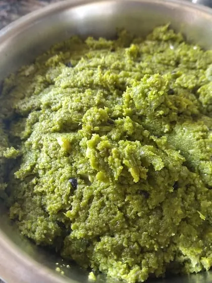 This is Jheengey aar Potoleyr khosha baataa, a paste made from the ground peels of ridge gourd and pointed gourd. It's a lip-smacking, rustic appetizer that honors the tradition of not wasting any part of the vegetable.