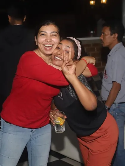 Two friends sharing a happy, candid moment.