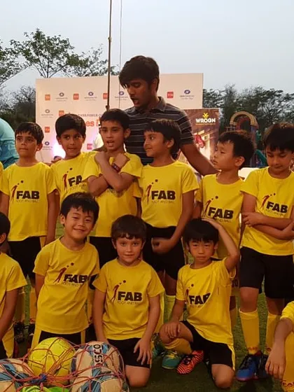 A large team photo. Football becomes a medium through which young players absorb life skills, setting the foundation for their holistic development.