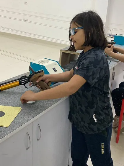 Nine year old Kaushiki Chauhan gets ready at the firing line. It's amazing to see such young shooters handle the equipment with confidence and discipline.