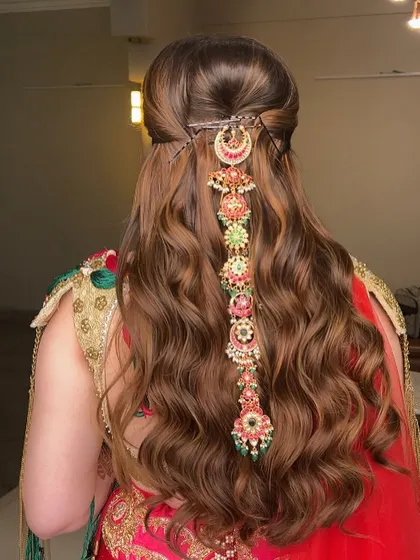 This hairstyle is all about making a regal statement, perfect for a bride who wants a truly unforgettable wedding day look.
