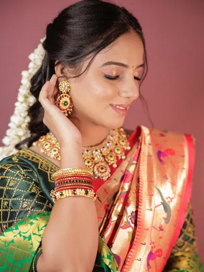A simple and elegant makeup demo for a student, showing a beautiful Paithani saree look.