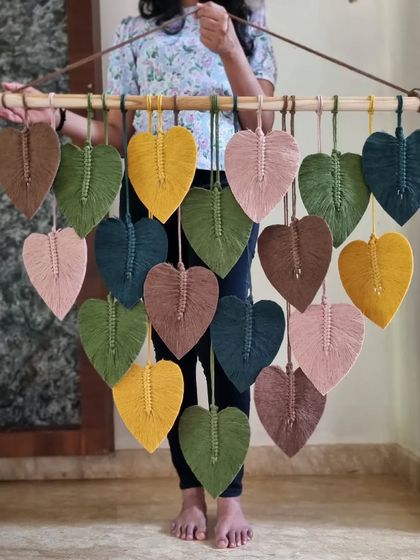 A boho-inspired decor piece that exudes natural beauty and earthy vibes. This macrame leaf hanging is perfect for those who want to connect with nature and create a cozy atmosphere.