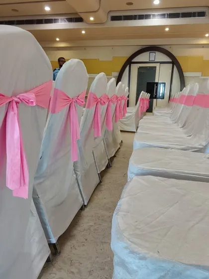 I provide chair rentals with covers and sashes in various colors to match your event's theme. Here, simple white chair covers are elevated with pretty pink bows for a baby shower.