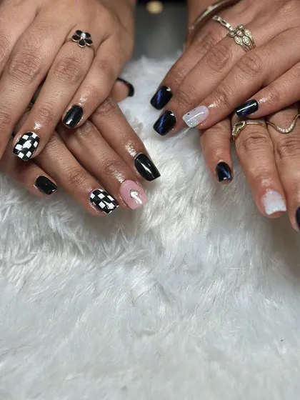 More amazing work from my seminar students, featuring a mix of black and pink nails with a checkerboard pattern and cat-eye effect.