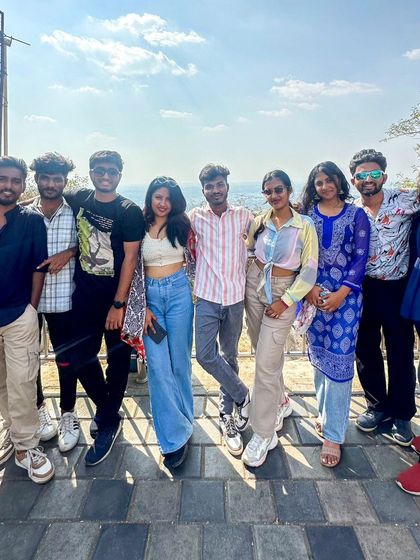A duplicate of the group posing for a photo on a sunny day in Mysore. The weather was perfect for exploring the city.