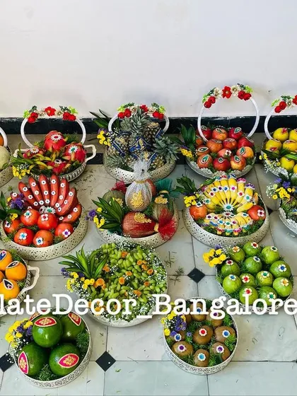 Here is a large collection of fruit platters I prepared for a single event. It shows my capacity to handle bulk orders while ensuring each platter, from decorated pomegranates to avocados, is unique and vibrant.