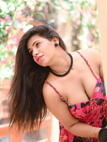 An outdoor portrait that uses natural light to create a soft, beautiful glow. This kind of candid, over-the-shoulder shot feels intimate and is perfect for lifestyle blogs and fashion features.