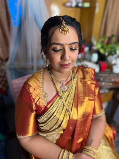 A close-up of the makeup for the naming ceremony. I created a soft, shimmery eye look with a warm lip color that photographed beautifully.