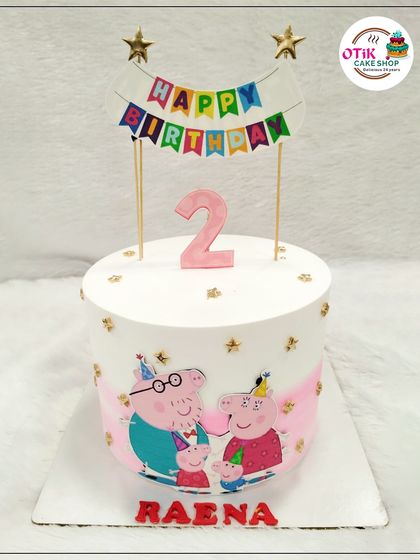 Oink oink! This Peppa Pig cake is perfect for a second birthday. We used an edible print of the Peppa Pig family and topped it with a colorful birthday banner for a fun and festive look.