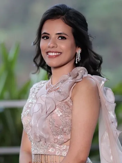 A beautiful portrait of engagement bride Rajvi. Her smile and the soft, glowing makeup create a look of pure happiness.