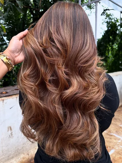 Her crowning glory. This stunning 'Butter Blonde' is warm, bright, and full of dimension. I used a balayage technique to create a natural, sun-kissed effect.