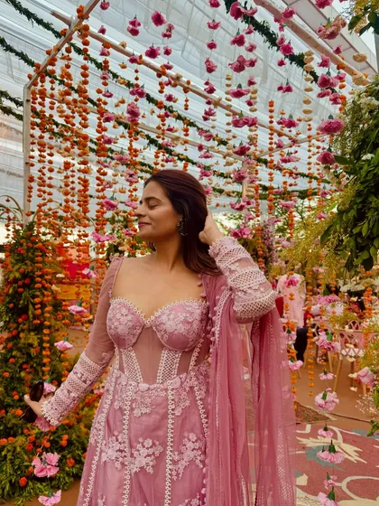 This pink corset Anarkali is a perfect example of modern ethnic wear for pear-shaped bodies. The corset snatches the waist, the puff sleeves broaden the shoulders, and the Anarkali flare flows beautifully over the hips.