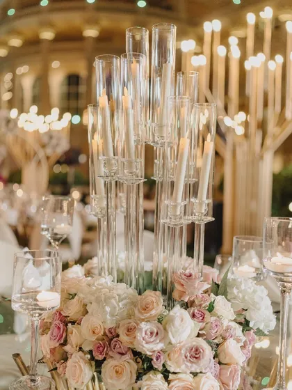A beautiful centerpiece with candles and flowers. This detail shot represents my belief that luxury is found in the smallest, most thoughtfully curated elements.