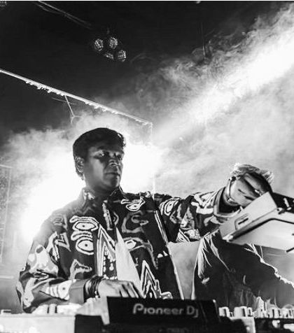 A black and white action shot from a B2B set. The smoke and lights add to the raw, underground atmosphere of the night.