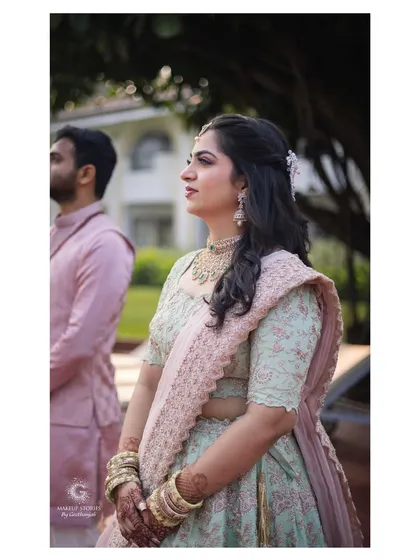 Reshma's beautiful and serene engagement ceremony in Goa. She wore a lovely pastel green and pink lehenga, and her makeup was soft and romantic to match the daytime, outdoor setting.