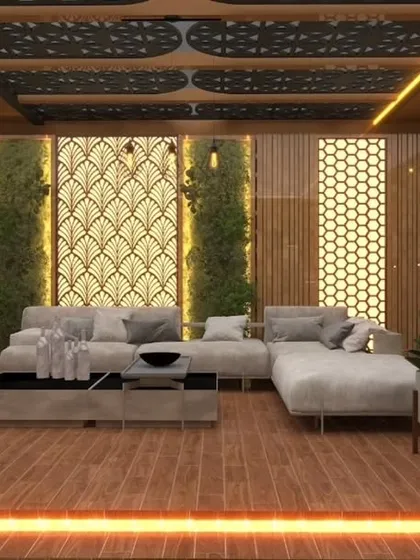 A luxurious pergola design for a Paschim Vihar project, featuring decorative backlit jaali panels and a large sectional sofa on a wooden deck.