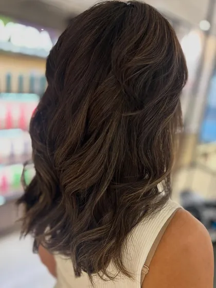 A fresh cut and color can make all the difference. I used classic highlights to add dimension and gave her a new haircut to complete this beautiful transformation.