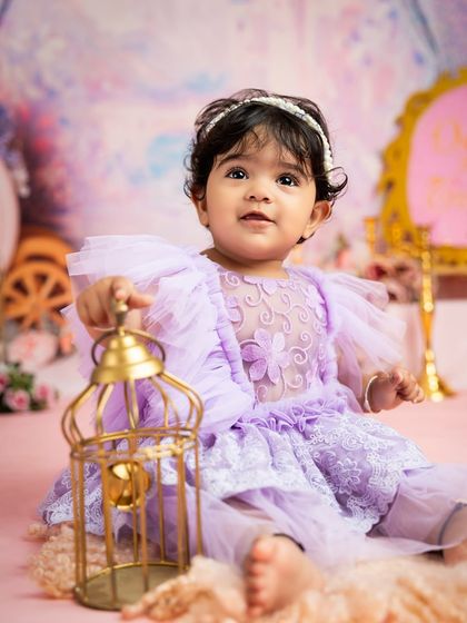 A curious princess exploring her magical kingdom. Props like this golden lantern add a touch of enchantment to the fairytale theme.