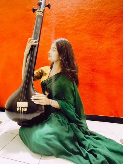 Another pose with the tanpura, reflecting my deep respect and love for the traditional roots of my music.