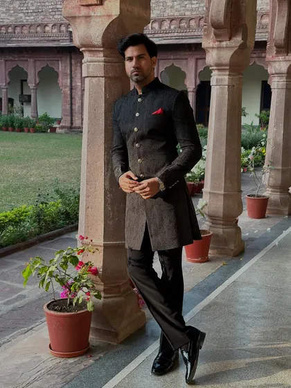 The classic black Achkan is the epitome of timeless royal style. Our bespoke version is tailored for a sharp, commanding silhouette, making it a distinguished choice for formal gatherings and wedding ceremonies.