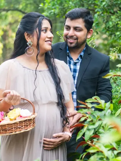 A walk through the garden. This candid shot captures the easy, happy connection between the expecting couple.